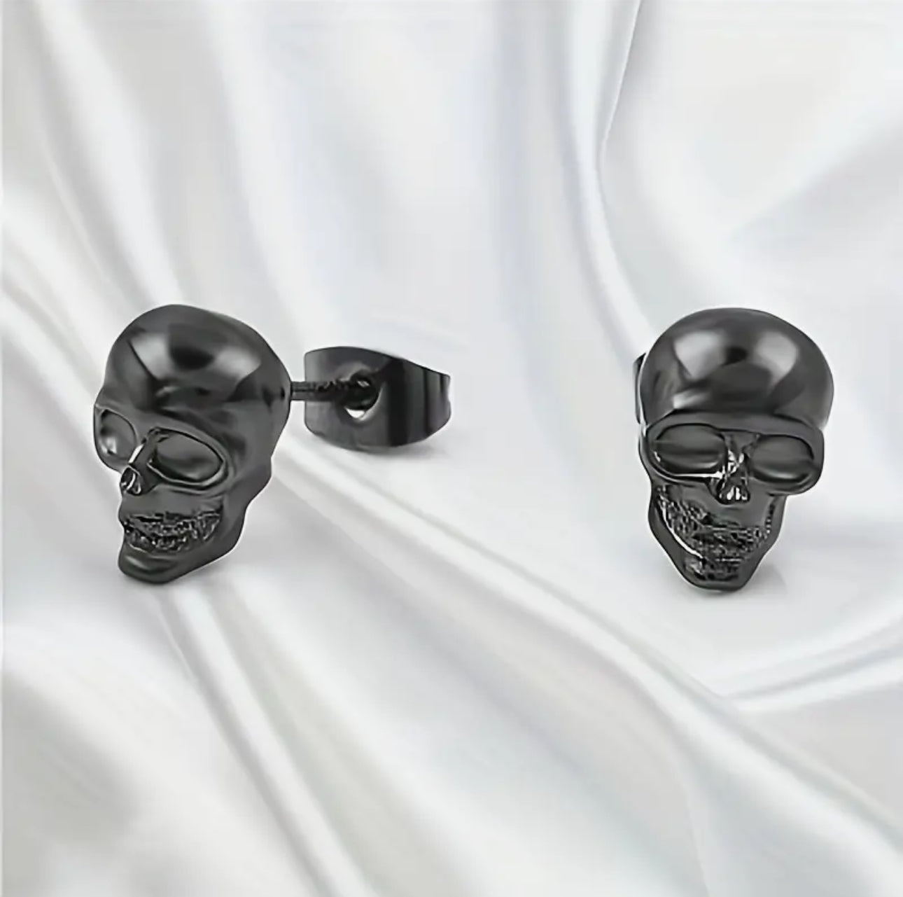 2 pairs of Skull Stud Earrings Skulls. 1 Pair Black, 1 Pair Silver. Stainless Steal Earrings. Unisex Punk Gothic Earrings.